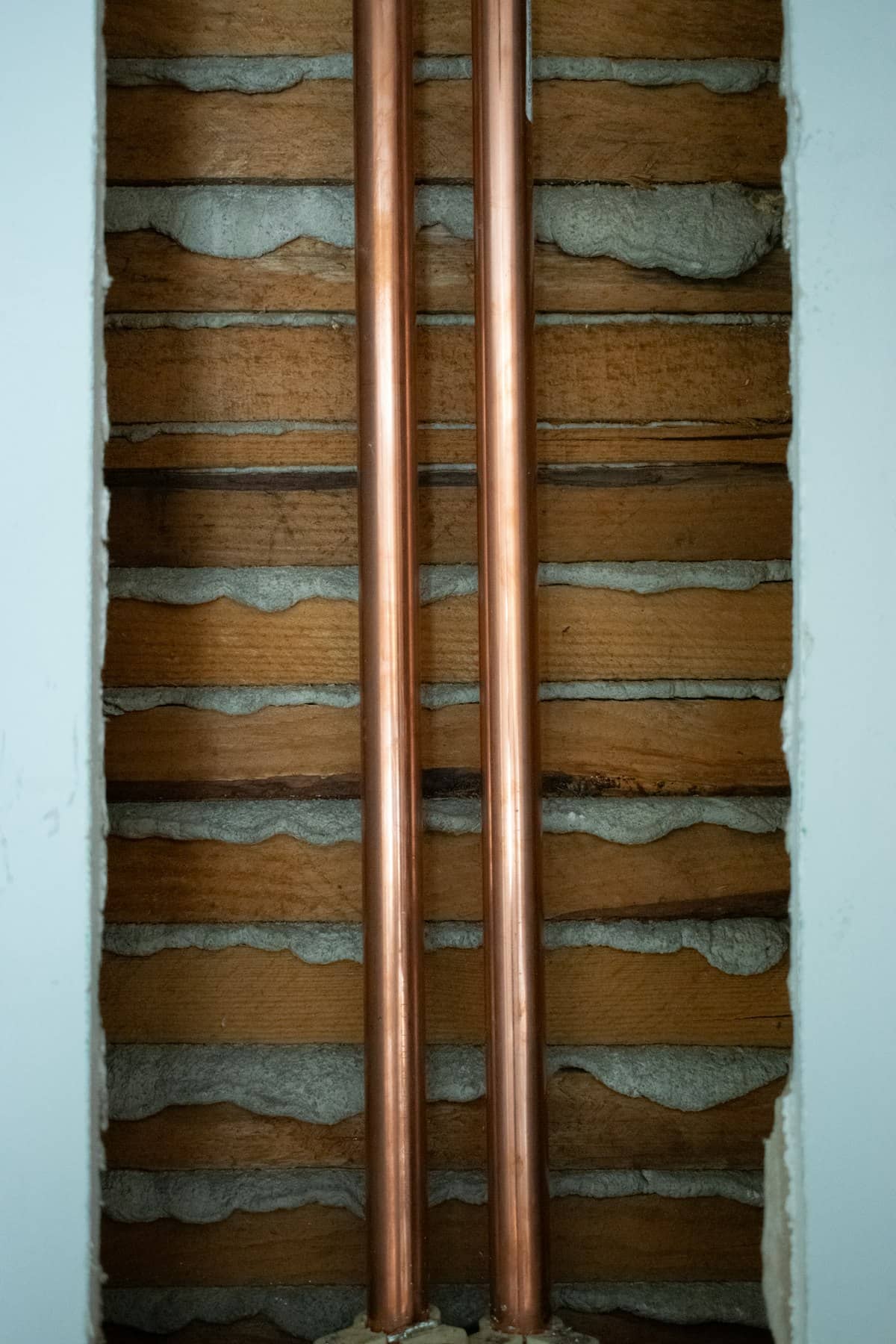 Copper supply lines installed in an open wall cavity